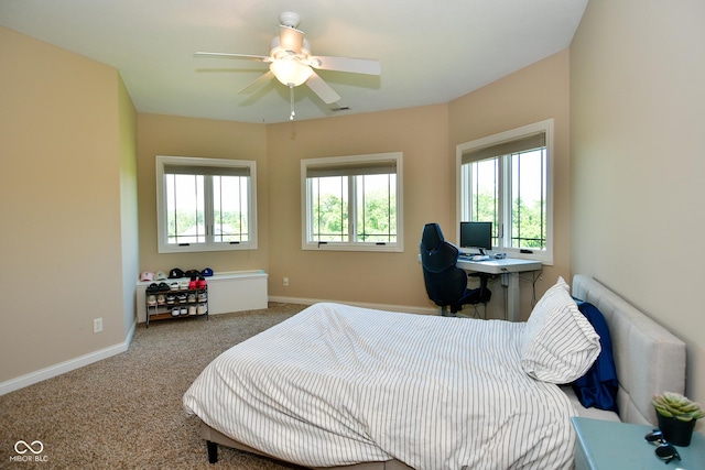 bedroom featuring a ceiling fan, carpet, visible vents, and baseboards