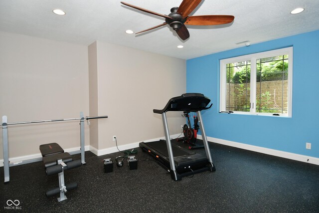 exercise area with a textured ceiling and ceiling fan