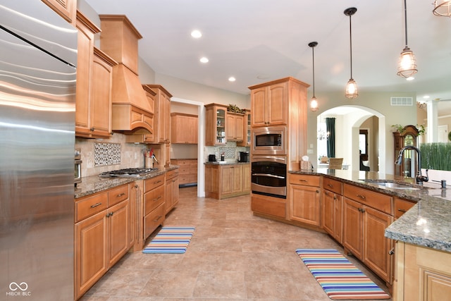 kitchen featuring light tile patterned flooring, sink, stainless steel appliances, and backsplash