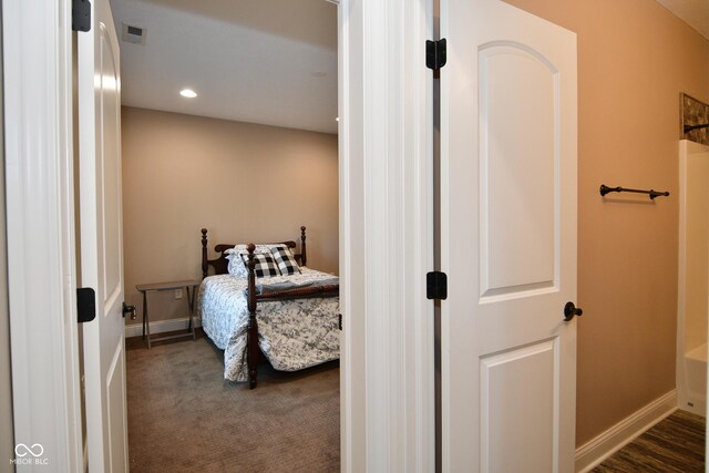 bedroom featuring dark colored carpet