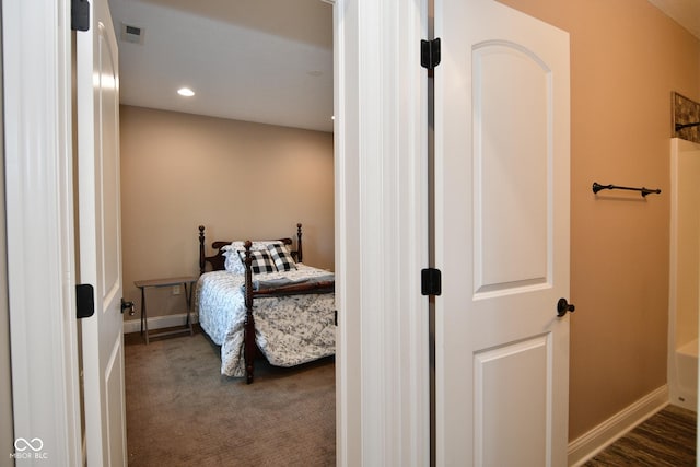 carpeted bedroom featuring recessed lighting, visible vents, and baseboards