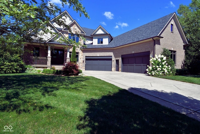 craftsman inspired home featuring a garage and a front yard