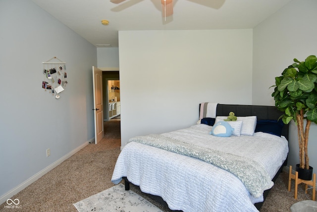 carpeted bedroom featuring baseboards and a ceiling fan