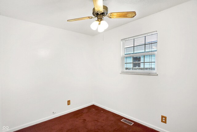 carpeted empty room with ceiling fan