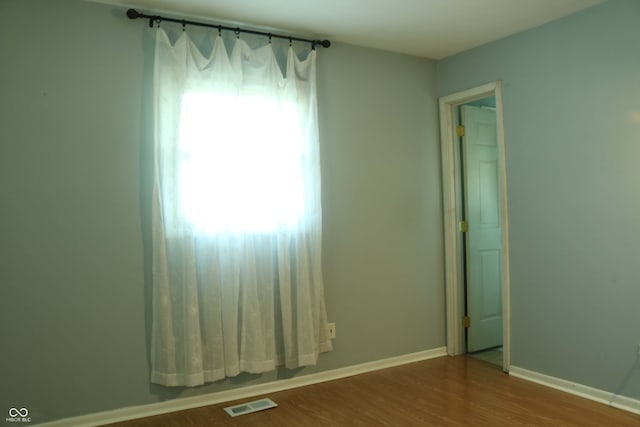 empty room featuring hardwood / wood-style floors