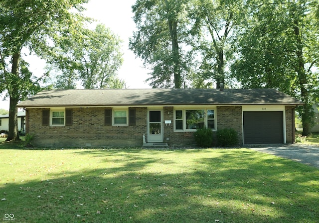 single story home with a garage and a front lawn