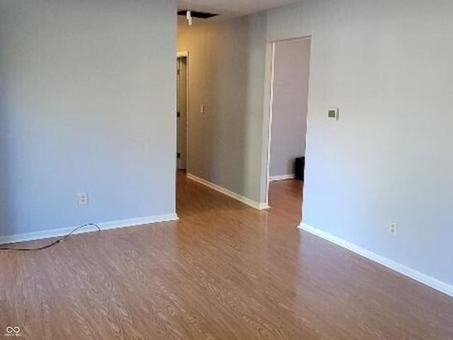 unfurnished room featuring hardwood / wood-style floors