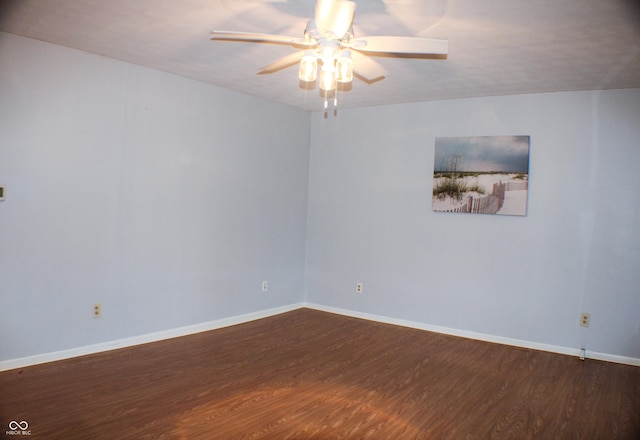 spare room featuring ceiling fan and dark hardwood / wood-style flooring