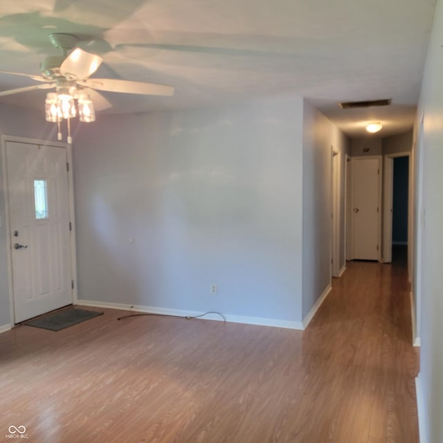 325 Franklin St, North Vernon, IN 47265 - entryway with wood finished floors, baseboards, and a ceiling fan