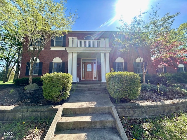 view of front of home with a balcony