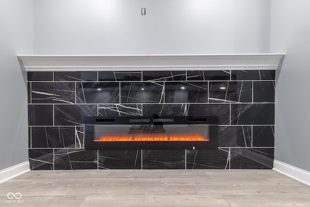 interior details with a tile fireplace