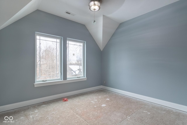 additional living space featuring ceiling fan and lofted ceiling