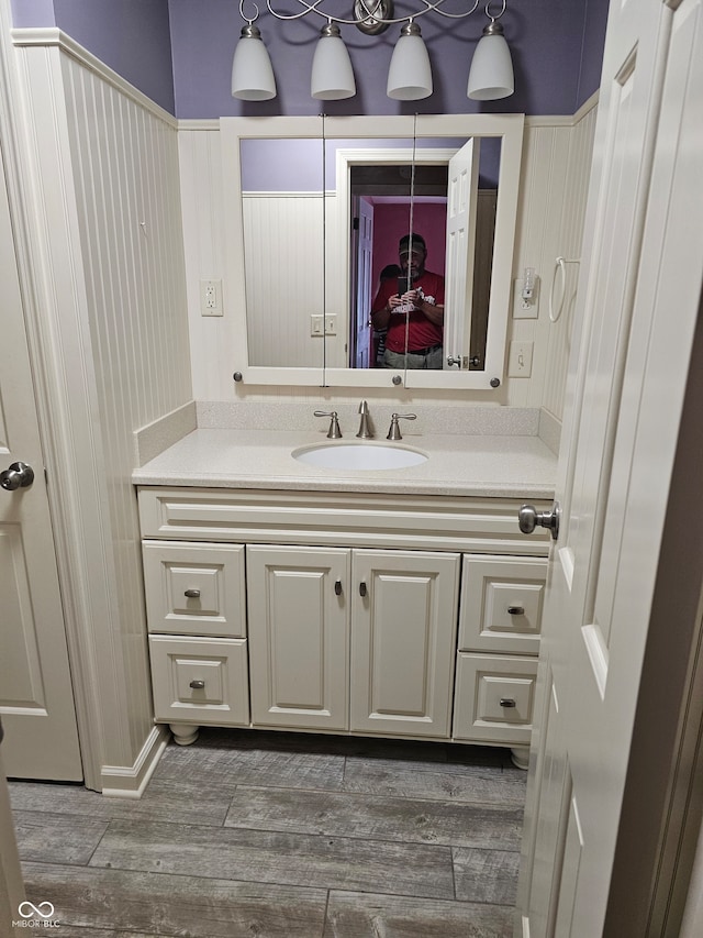 bathroom with vanity and hardwood / wood-style flooring