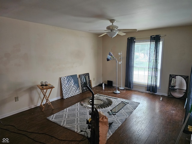 living area with ceiling fan and hardwood / wood-style flooring