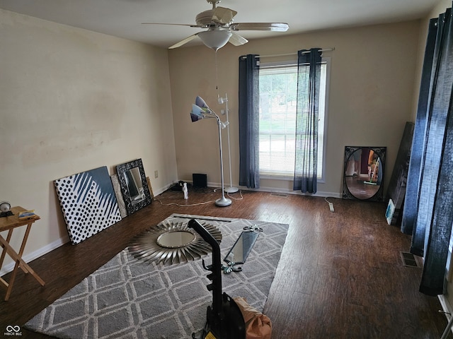 sitting room featuring dark hardwood / wood-style flooring and ceiling fan