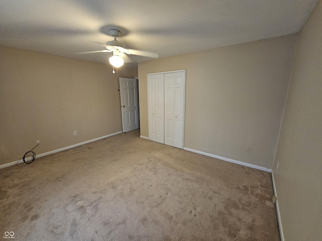 14 Winchester Ct, Anderson, IN 46013 - unfurnished bedroom with baseboards, carpet flooring, ceiling fan, and a closet
