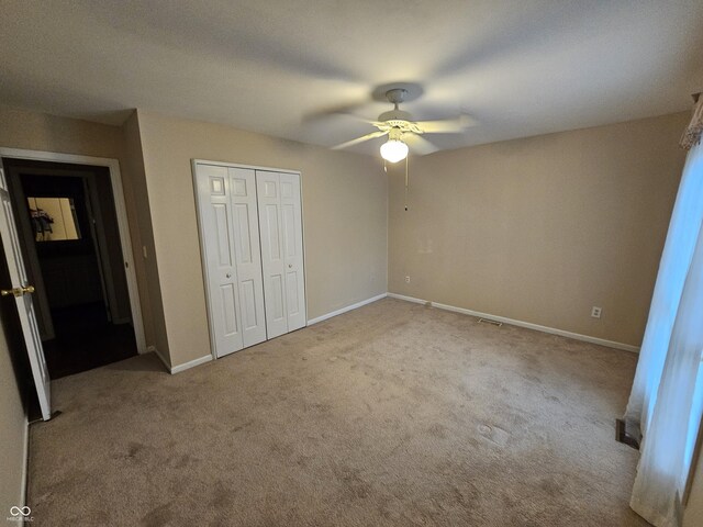 14 Winchester Ct, Anderson, IN 46013 - unfurnished bedroom with carpet floors, baseboards, and a closet