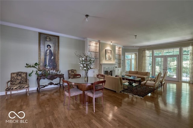 living room with ornamental molding, hardwood / wood-style floors, and french doors