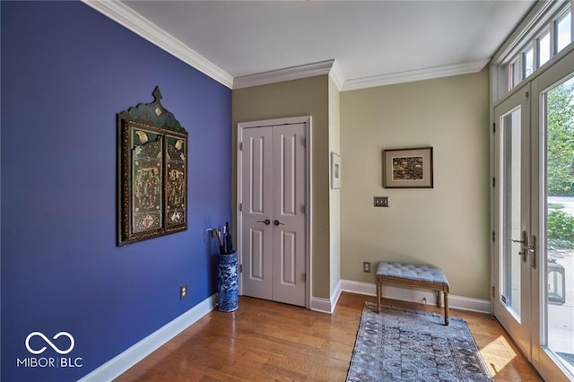 foyer with crown molding, french doors, and hardwood / wood-style flooring