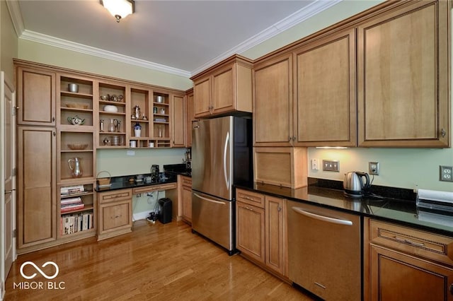 kitchen featuring crown molding, stainless steel appliances, built in desk, and light hardwood / wood-style flooring