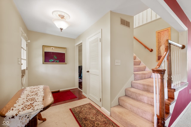 view of carpeted foyer