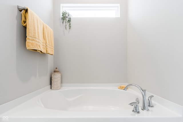 bathroom with a tub to relax in