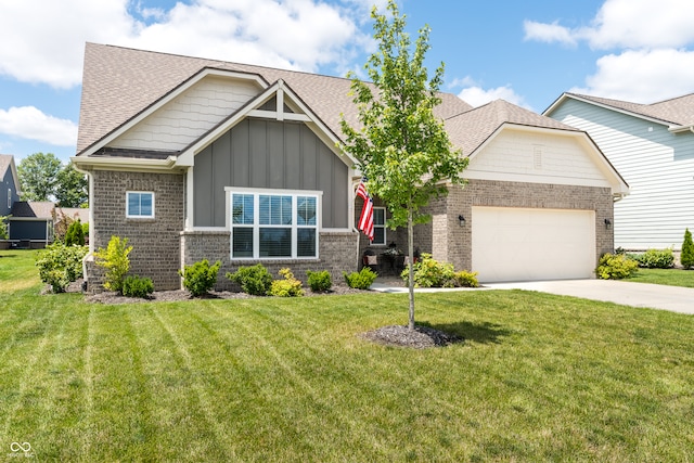 craftsman house with a front yard and a garage