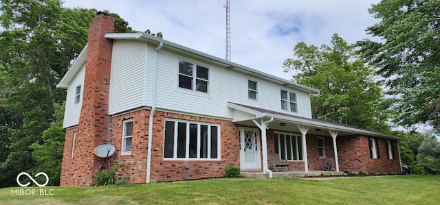 view of property with a porch and a front yard