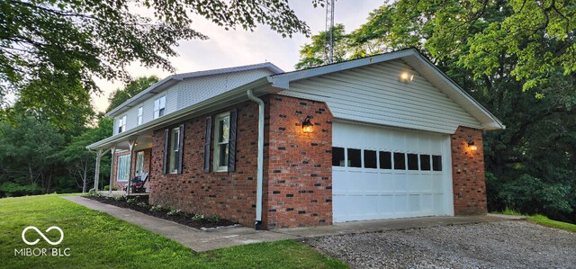 view of side of home with a garage