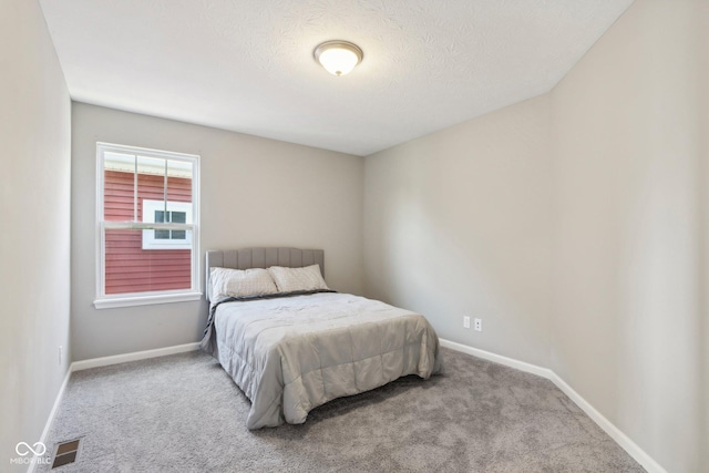 bedroom featuring light carpet