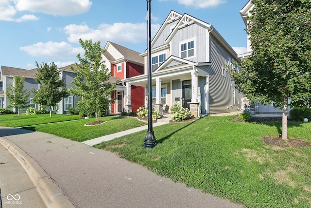 craftsman house featuring a front lawn and a porch