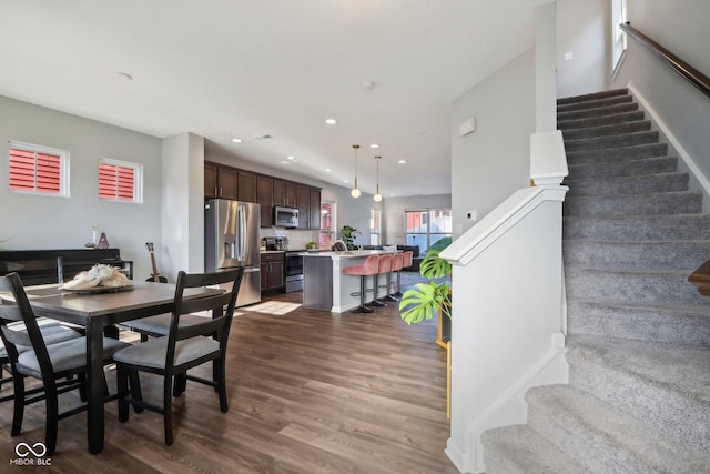 dining area with dark wood-type flooring