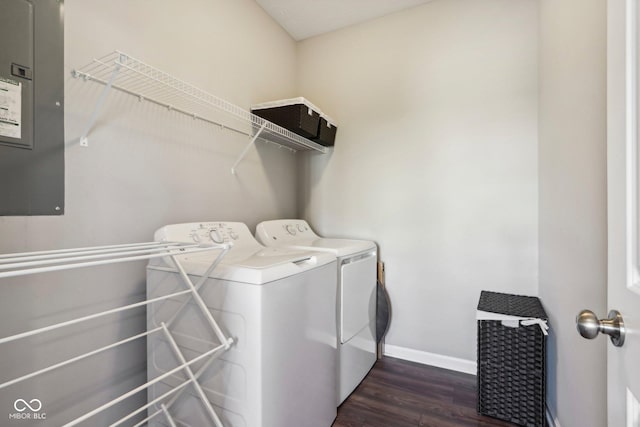 washroom featuring washer and dryer, dark hardwood / wood-style floors, and electric panel