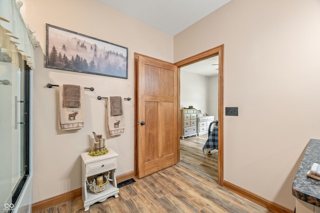 hall featuring wood-type flooring