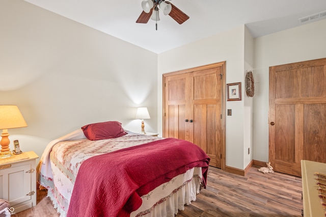 bedroom featuring ceiling fan and wood-type flooring