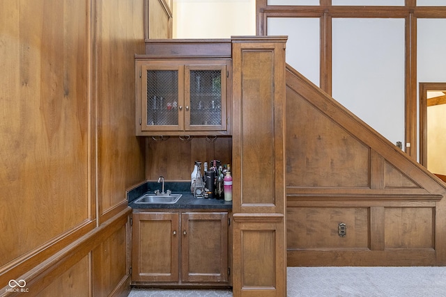 bar with wet bar and a sink