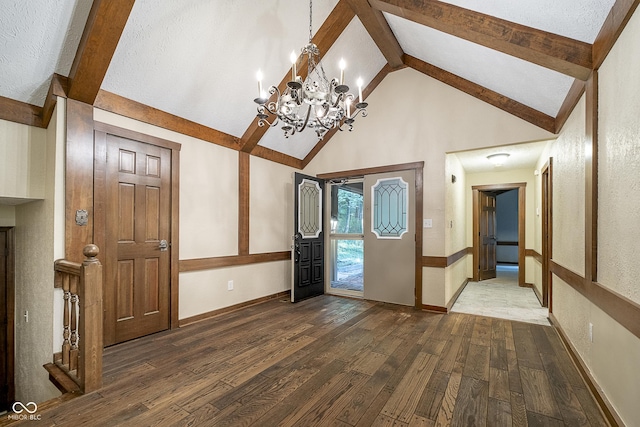 foyer with baseboards, beam ceiling, high vaulted ceiling, and hardwood / wood-style floors