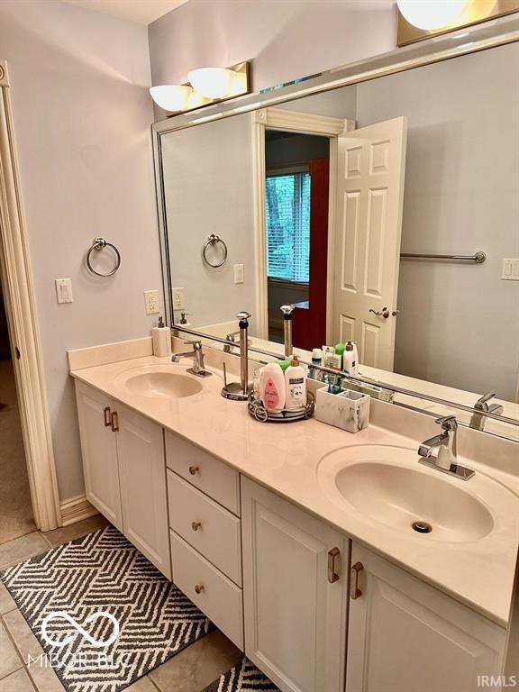 bathroom with vanity and tile patterned flooring