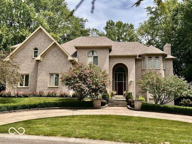 view of front of home with a front yard