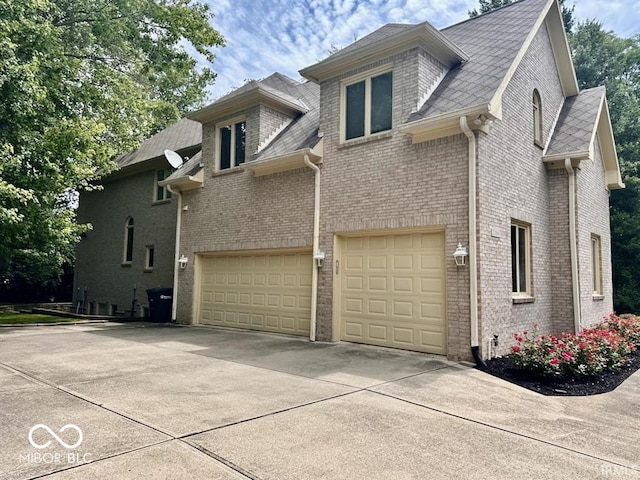 view of property exterior with a garage