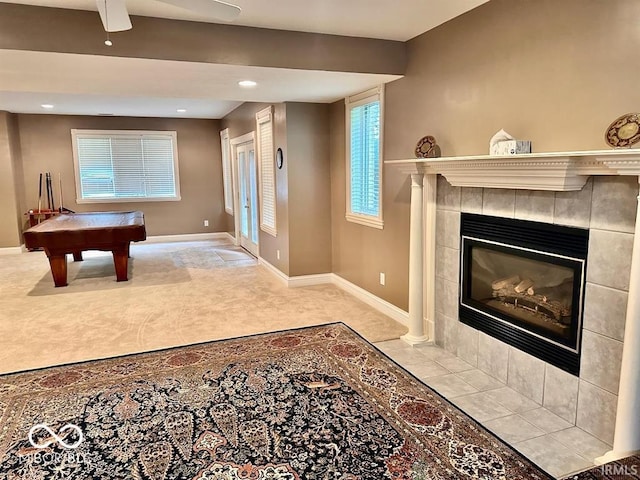 recreation room featuring billiards and a tile fireplace