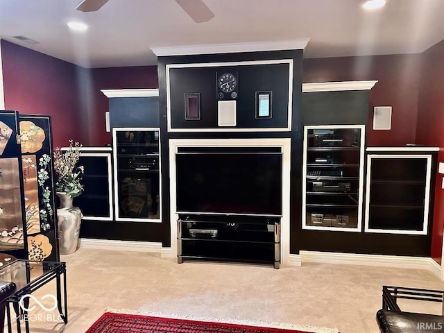 carpeted living room featuring ceiling fan