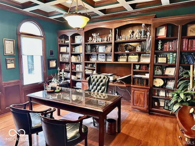 office area featuring coffered ceiling, ornamental molding, light hardwood / wood-style floors, and beamed ceiling