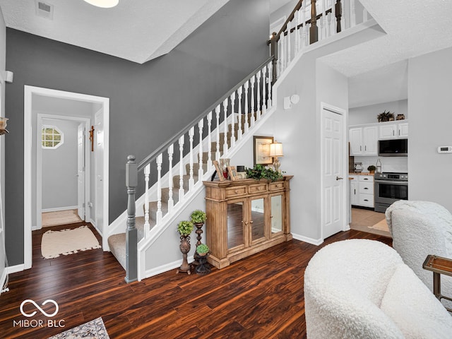 stairway with wood-type flooring