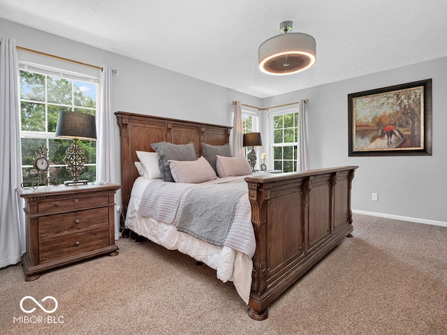 bedroom with light carpet