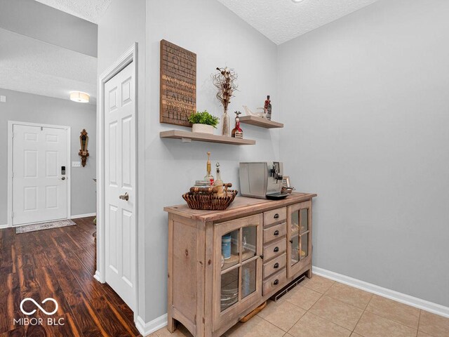 interior space featuring hardwood / wood-style floors and a textured ceiling