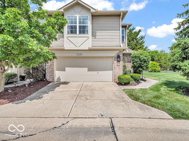 view of front facade featuring a garage and a front yard