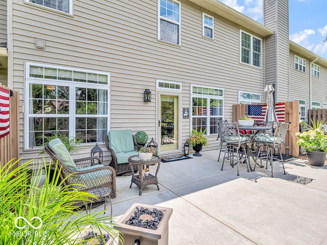 view of patio with a fire pit