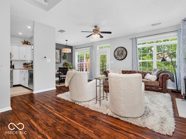 living room with ceiling fan and hardwood / wood-style floors