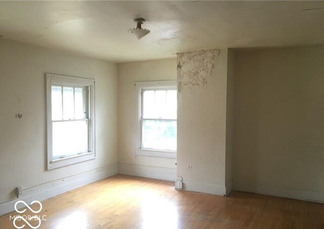 3358 Ruckle St, Indianapolis, IN 46205 - empty room featuring light hardwood / wood-style flooring